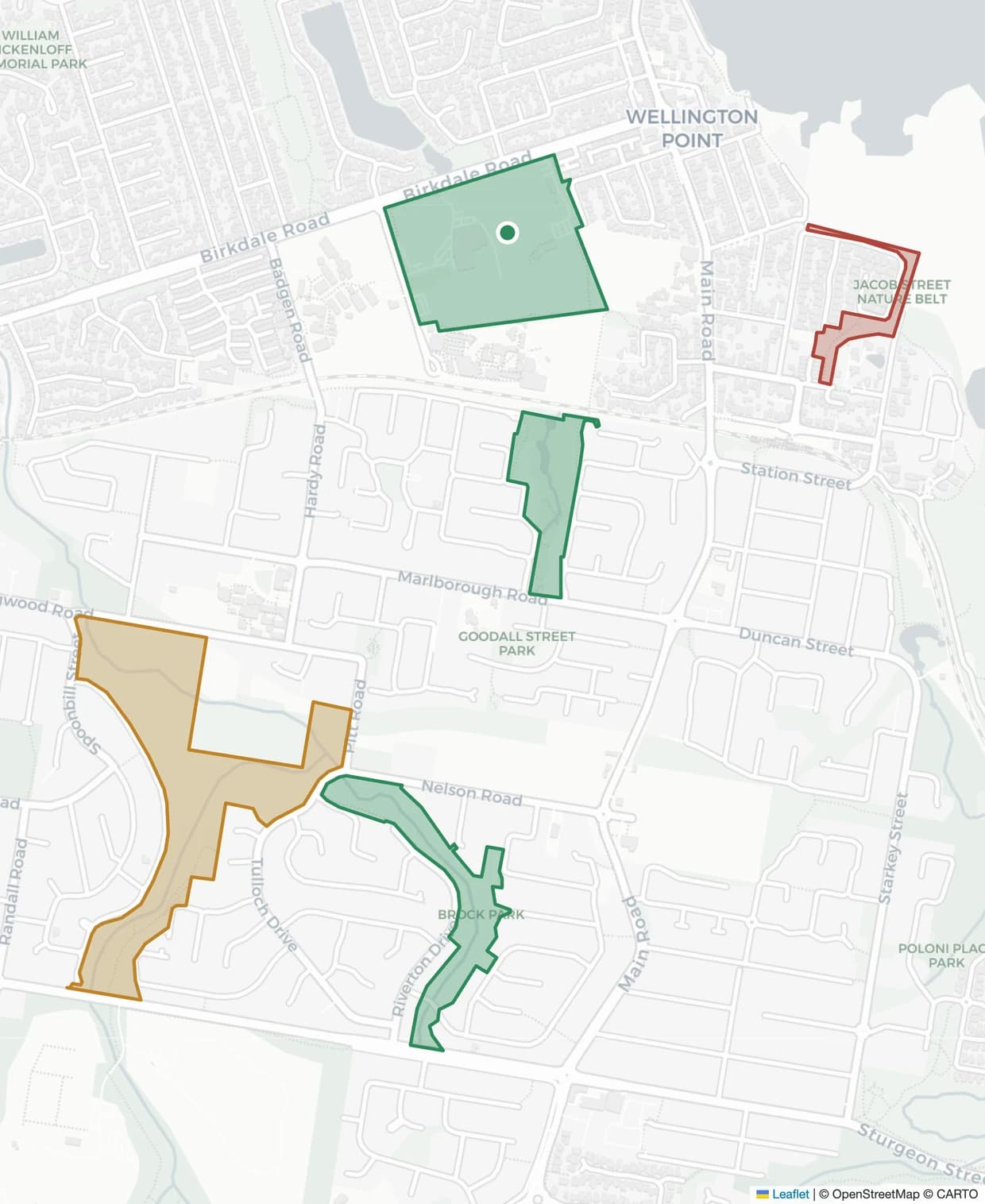 Compliance map of a coastal council area: real streets and reserves with site boundaries shaded by maintenance status — a mown point reserve current, wetlands due for slashing, and a creek corridor overdue with a crew on site.